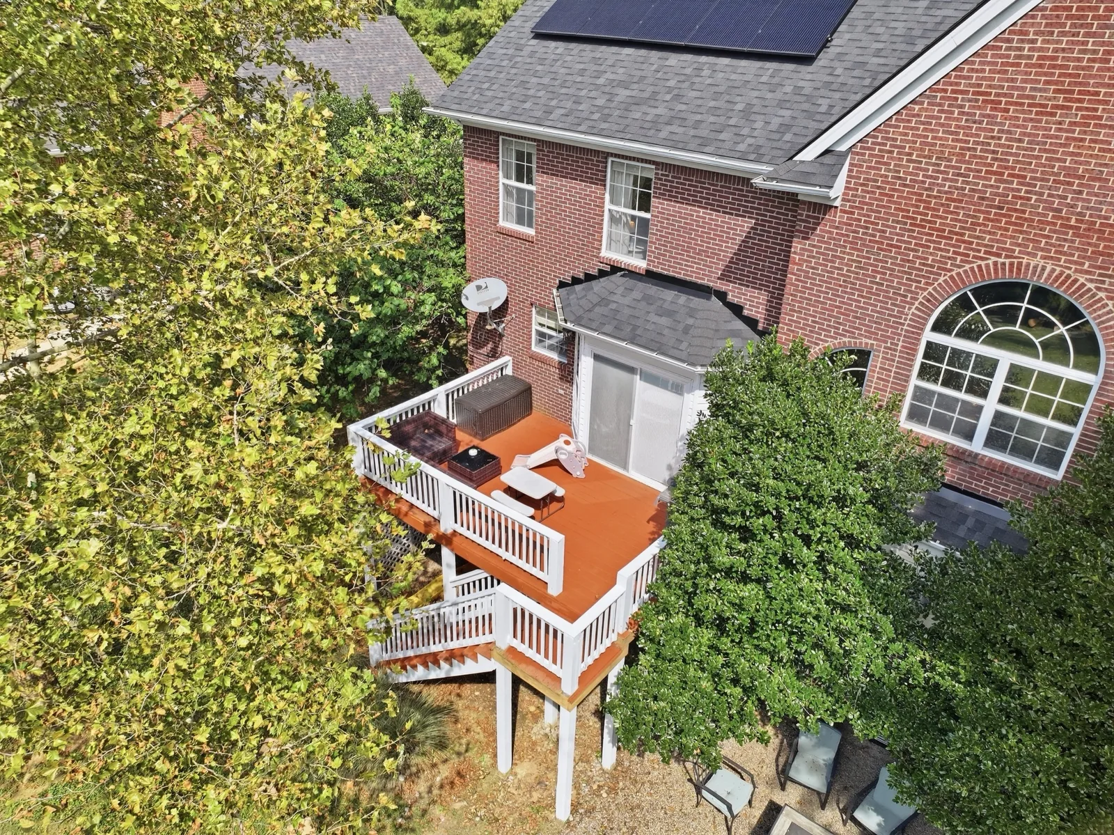 The back of the house from above, with the deck and the solar panels