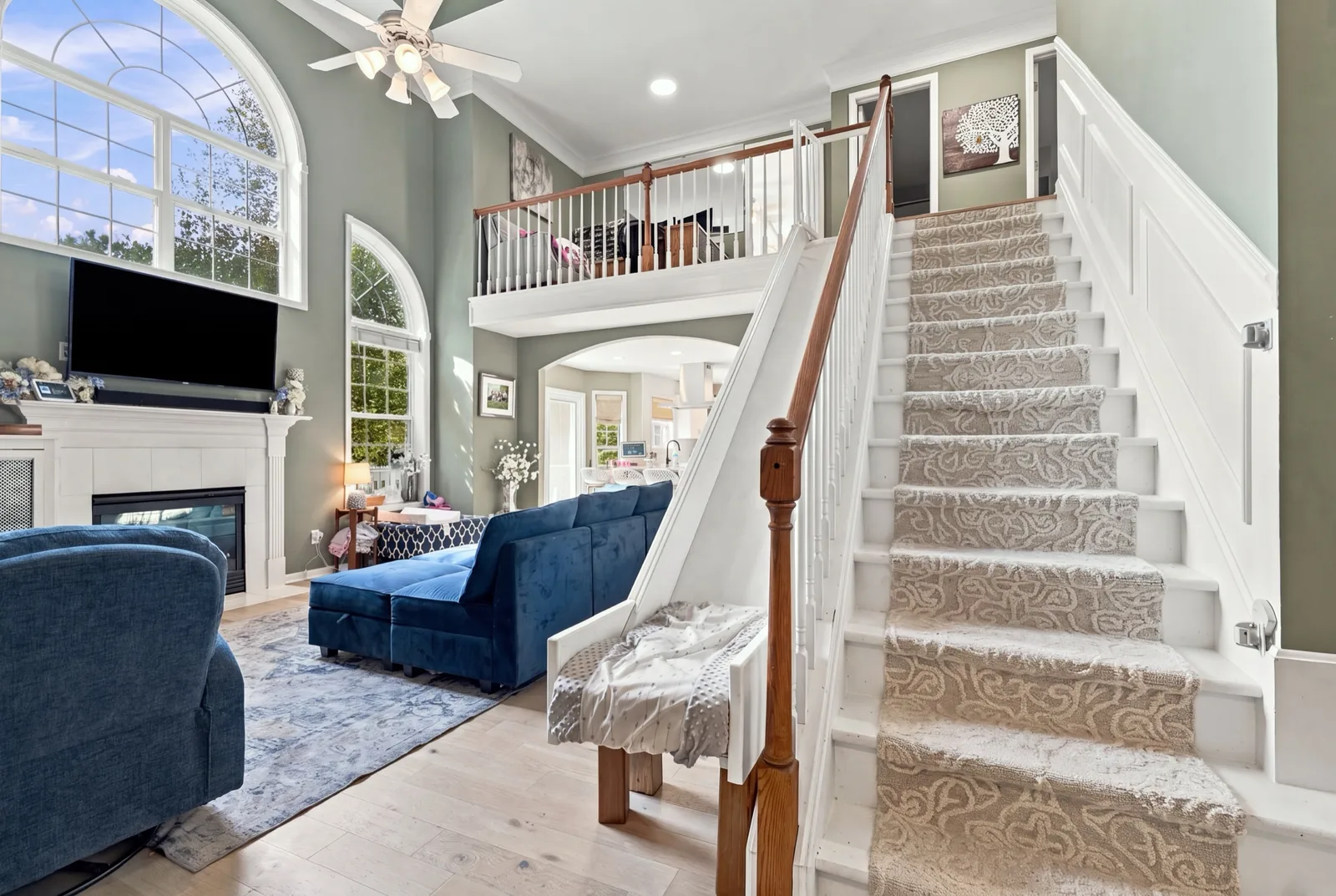 The staircase, with a white custom slide running beside it