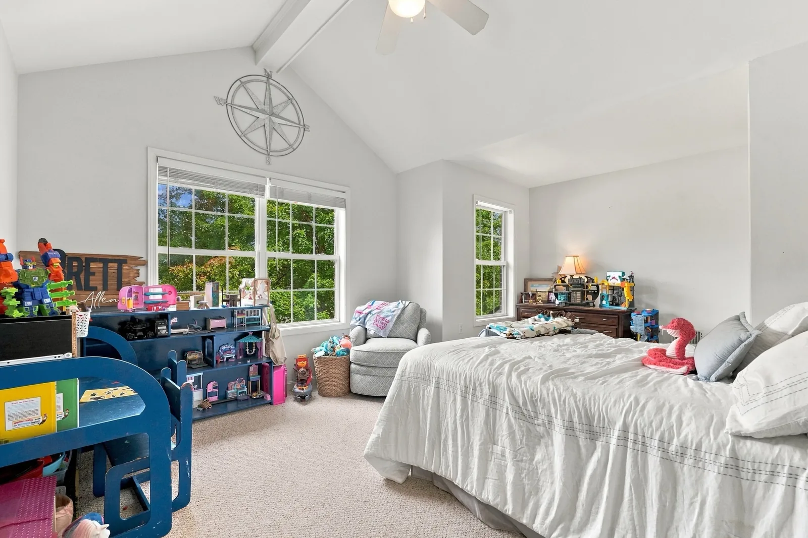 Upstairs bedroom with a vaulted ceiling