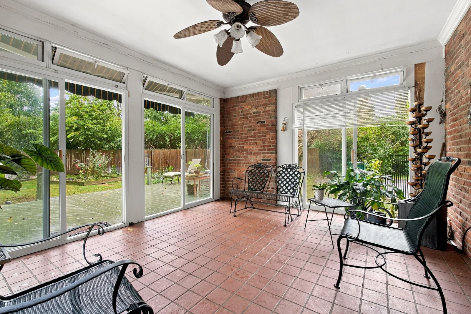 The sunroom with sliding windows onto the deck